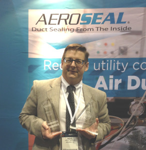 Aeroseal’s Neal Walsh at AHR EXPO with both the AHR Award in the Ventilation category and the “Best of Show” Product of The Year Award. 